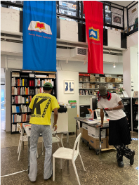 photo of two people in bookstore | moku